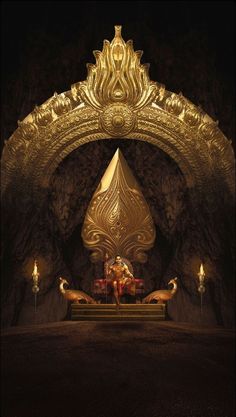 an elaborately designed room with candles lit up in the background and a gold sculpture on the wall