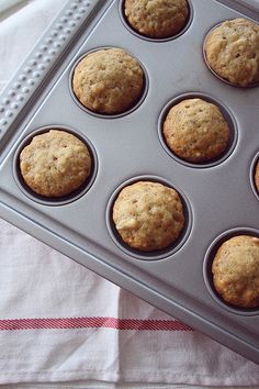 muffins sitting in a pan on top of a table