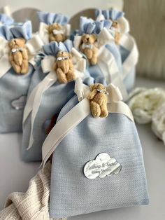 several small blue bags with teddy bears in them