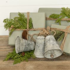 christmas presents wrapped in twine and tied with twine, pine cones and evergreen needles