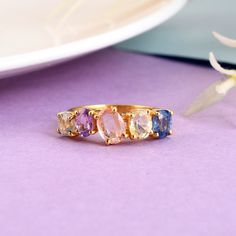 Make a splash with this beautiful prong set multi sapphire gemstone ring in 925 silver and yellow gold rhodium plated (nikle free). all are products are handmade,absolutely new and unworn . ѻ Gemstone : Natural multi colour sapphires  ѻ Metal : Sterling Silver with yellow gold rhodium plating  ѻ Gemstone Size : multiple                               ѻ Current ring size Available : US 7 ѻ Gemstone Cut : full cut multi shapes  All of our jewelry are made with handpicked semiprecious stones and gemstones.  Due to the nature of these semiprecious stones a slight variation in colors may be noticed between the pictures and the real piece. Although we guarantee that this is barely noticeable.  Real Gemstones and semiprecious stones naturally consists of inclusions.  In other words these stones/mi Yellow Gold Crystal Ring With Stone Setting, Fine Jewelry Multi-stone Topaz Rings, Fine Jewelry Topaz Multi-stone Rings, Multi-stone Topaz Promise Ring, Cubic Zirconia Sapphire Open Ring, Gold Multi-stone Sapphire Open Ring, Fine Jewelry Hallmarked Sapphire Open Ring, Hallmarked Sapphire Open Ring In Fine Jewelry Style, Hallmarked Open Sapphire Ring Fine Jewelry