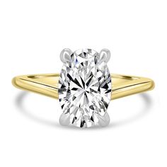 a yellow gold engagement ring with a round cut diamond in the center, on a white background