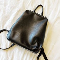 Black Vegan Leather Backpack From Matt & Nat. Zips To A Big Compartment With Two Interior Pockets. Pocket On Back Side For Secure Key / Wallet Storage. Pebbled Leather. Fits A 13” Laptop Wallet Storage, Leather Fits, Vegan Leather Backpack, Matt & Nat, Key Wallet, Black Vegan, Pebbled Leather, Leather Backpack, Vegan Leather