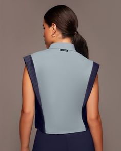 Designer's Notes PREORDER - Expected to ship on August 4th. Performance-engineered top with a sleek and boxy cut to define the shoulders and narrow-in on the waist line. Features an invisible front zipper to adjust the neckline collar as desired. Features Sweat wicking Two-way stretch Exceptional breathability Perforated insert shoulder band and side panel Stand collar with invisible zipper front Made with Love in Canada Size & Fit Slim - Streamlined to hug the body Modeled in size S Model Measu Functional Fitted T-back Activewear, Functional Workout Tops With Zipper Closure, Fitted Sporty Top With Zipper Closure, Compressive Sportswear Top With Built-in Padding, Functional Sleeveless Blue Activewear, Desired Features, Sleevless Top, Admiral Blue, Activewear Inspiration