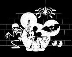 an image of mickey mouse and skeleton on a brick wall with the word halloween written in white