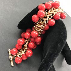 ON SALE Fun colorful Kenneth lane KJL signed red beaded cha-cha bracelet. The red cha-cha balls are made up of Lucite. The bracelet measures 8 inches long by approximately 1 1/2 inches wide. A really nice designer piece that will give a perfect pop of color to any collection or wardrobe. Red Costume Jewelry Bracelets As Gift, Red Metal Beaded Bracelet With Round Beads, Red Metal Costume Jewelry Bracelets, Red Metal Costume Jewelry Bracelet, Red Metal Chain Bracelet, Handmade Red Metal Charm Bracelet, Party Bracelets With Chain And Round Beads, Red Large Beads Bracelets For Party, Red Bracelets With Large Beads For Party