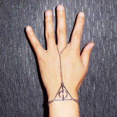 Stop. In the name of the Deathly Hallows. | 17 Pieces Of Harry Potter Bling That Can Charm Even Muggles Harry Potter Bracelet, Stile Harry Potter, Harry Potter Accessories, Fandom Jewelry, Steampunk Rings, Harry Potter Deathly Hallows, Harry Potter Jewelry, Harry Potter Outfits, Harry Potter Diy