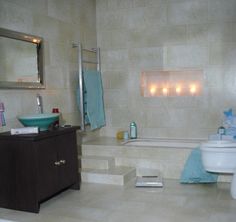 a bathroom with a sink, toilet and bathtub