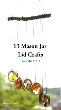 a wind chime with five glass balls hanging from it's sides and the words 13 mason jar lid crafts