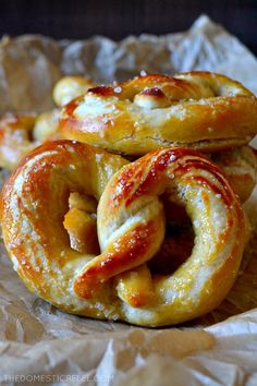 some pretzels sitting on top of each other with the words perfect and easy soft pretzels