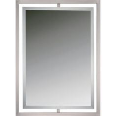 a bathroom mirror that is on the wall