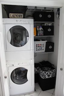 a washer and dryer are in the closet next to each other on the floor