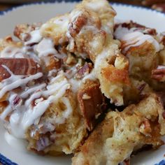 a close up of a plate of food with doughnuts and icing on it