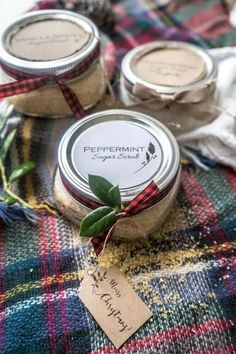 three jars of peppermint body butter sitting on a plaid blanket with a tag