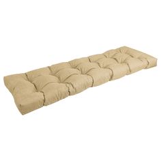 an outdoor bench cushion with no cushions on the top and bottom, in tan fabric