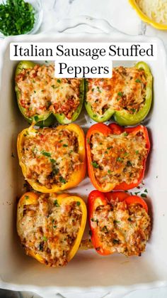 stuffed bell peppers in a white casserole dish with parmesan cheese on top