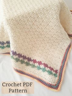 two crocheted blankets on top of each other