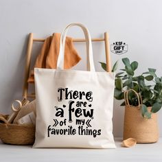 There A re a Few of My Favorite Things Tote Bag, Reusable Bag, Favorite Things Totes, Grocery Bag, Shopping Bag, Sassy Tote Bag, Canvas Bags Personalized tote bags are perfect for yourself, Your Company, or as a gift! These are also the ideal bride's, Bridal Shower, Baby Shower, Birthday Party, gift, or proposal gift. IMPORTANT! Natural, White, Gold, Yellow, And Pink color totes Will be black Text color; all Other Colors Will Be White. PRODUCT *Measurements15"L x 16"H *12 oz./yd² (US), 20 oz (CA Eco-friendly Bag With Letter Print For Gift, Eco-friendly Bags With Letter Print For Gifts, Eco-friendly Reusable Shoulder Bag For Gifts, Eco-friendly Letter Print Shoulder Bag Gift, Reusable Tote Shoulder Bag For Gifts, Blank Tote Bag, Canvas Bags, White Product, Personalized Tote Bags