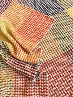 an orange, yellow and black checkered fabric