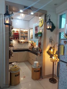 a kitchen filled with lots of clutter and lights on top of the counter tops