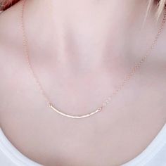 The Hammered Curved Gold Necklace is our magic touch for your neckline. This jewelry piece adds a touch of sophistication to your look with your minimalist jewelry style. Crafted with a dainty, 14k gold filled chain and gold charm, this necklace is the perfect complement to any outfit, or any necklace layer. Crafted with precision, both chain and charm are gold filled yet light and comfortable for everyday wear. 14K gold filled chain 14k gold lobster clasp 2 inch curved 14k skinny bar 16 & 18 in Hammered Jewelry, Gold Bar Necklace, Hammered Gold, Silver Bars, Jewelry Companies, Gold Filled Chain, Gold Charm, Bar Necklace, Minimalist Jewelry