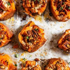 baked sweet potatoes topped with pecans and parmesan cheese