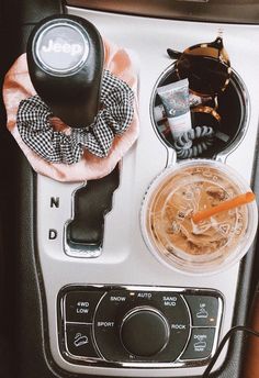 the interior of a car with an air freshener dispenser and other items