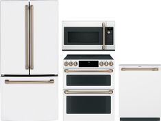 a white refrigerator freezer sitting next to two ovens