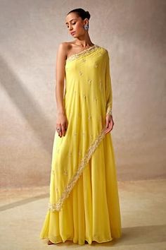 Yellow cape style sleeves one shoulder jumpsuit in georgette base with vine gardenia embellishments using cut dana highlights. - Aza Fashions Indian Readymade Saree, One Sided Sleeve Dress, One Shoulder Haldi Outfit, Jumpsuit Indian Outfit, One Shoulder Suits Indian, Side Open Kurti Designs, One Shoulder Indian Outfits, Indowestern Jumpsuit, Indo Western Outfits Wedding