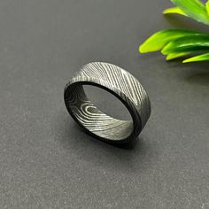 A premium and unique ring made from precious Damascus steel and has an acid finish that wraps around the ring. If you're looking for a simple option, this ring offers a unique yet simplistic aesthetic. The attractive design has an elegant polished surface. Damascus bands are made from a combination of two different types of steel that are folded and twisted together. This method creates their unique and characteristic wavy design.   Weight: 6-9 grams (ring itself) depending on the size of the ring. The package includes: 1x Damascus steel ring in a poly bag 1x ring box How to care for Damascus Band: Keep in mind that moisture is the enemy of Damascus steel in general, whether it's a $1000 ring or a $30 ring. If your fingers sweat a lot or the ring is wet, it is prone to corrosion. Fortunate Him Aesthetic, Simplistic Aesthetic, Aesthetic Band, Damascus Ring, Damascus Steel Ring, Wavy Design, Unique Ring, Poly Bags, Damascus Steel