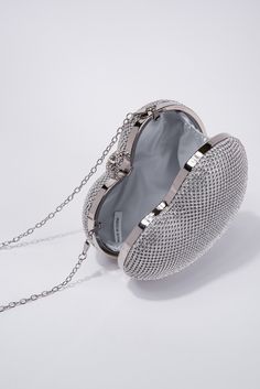 Expertly crafted with a crystal heart shape, the Reese Evening Bag adds an elegant touch to any outfit. Designed with a detachable crossbody strap, this bag offers versatility and convenience. Perfect for a night out, let the Reese Bag be your stylish and functional companion. SizeHEIGHT: 8"WIDTH: 7.5"DEPTH: 3" QualityMade with Quality Materials for Endurance. ImportedBAG11269 Heart-shaped Evening Bag With Chain Strap, Heart-shaped Evening Bags With Chain Strap, Elegant Heart-shaped Bag For Everyday Use, Elegant Heart-shaped Bags, Elegant Crystal Embellished Crossbody Bag, Heart-shaped Shoulder Bag With Chain Strap For Party, Heart-shaped Party Shoulder Bag With Chain Strap, Glamorous Heart-shaped Evening Bag, Luxury Heart-shaped Party Shoulder Bag