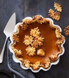 an image of a pie with leaves on it and another photo of the same pie