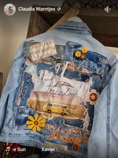 the back of a jean jacket with patches and flowers on it