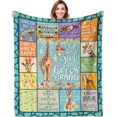 a woman holding up a blanket with giraffes and words on the front