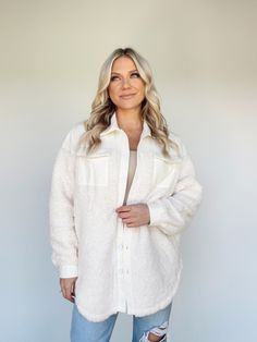 Experience the ultimate in luxurious layering with our Slope Side Shacket. This slouchy piece features an on-trend collared neckline, sherpa construction, pocket details, and subtle button closures - perfect for curating any look. Soft and sumptuous, the long length and rounded hem keeps you cozy in style. Perfect for shopping, errands, and brunch date, this versatile shacket is the go-to for bright, ultra-soft layering. 100% Polyester Hand wash cold. Cozy Outerwear With Pockets For Day Out, Chic Long Sleeve Outerwear With Soft Texture, Cozy Spring Shacket With Pockets, Cream Collared Shacket With Pockets, Collared Cream Shacket With Pockets, Cozy Button-up Outerwear For Day Out, Everyday Cream Collared Shacket, White Collared Shacket For Everyday, Chic Collared Shacket For Day Out