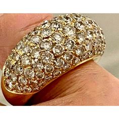 A true statement ring: 18 karat yellow gold dome cocktail ring, embellished with 3.5 carats of colorful, sparkly pavé set VS1 diamonds. Hallmarked with jeweler's mark in cartouche but is illegible. Size US 6. Made in France, circa mid to late 20th century. Sparkling Yellow Gold Diamond Ring, Dazzling Dome Ring With Diamond Accents For Formal Occasions, Formal Yellow Gold Sparkling Diamond Ring, Formal Sparkling Yellow Gold Diamond Ring, Gold Domed Diamond Ring With Accents, Sparkling Yellow Gold Diamond Ring For Formal Occasions, Luxury Elegant Collectible Dome Ring, Gold Dome Ring With Pave Diamond Setting, Dazzling Dome Ring With Pave Setting