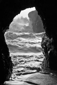 an ocean cave with waves coming in and out