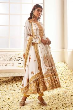 White anarkali with floral blossom print highlighted by placed thread embroidery and stone work. Comes with pant and dupatta. - Aza Fashions Anarkali Sharara With Intricate Embroidery In Maxi Length, Anarkali Salwar Kameez With Intricate Embroidery For Diwali, Bollywood Style Maxi Length Sharara With Intricate Embroidery, Traditional Floor-length Anarkali Set With Intricate Embroidery, Maxi Length Salwar Kameez With Intricate Embroidery For Reception, Traditional Floor-length Churidar With Intricate Embroidery, Traditional Embroidered Maxi Sharara, Intricate Embroidery Maxi Length Sharara For Festivals, Embroidered Floor-length Lawn Suit For Reception