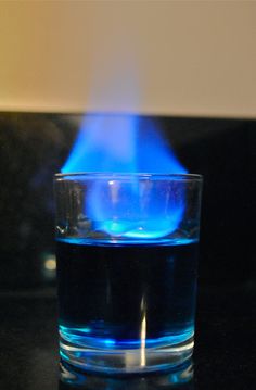 a blue flame in a glass of water