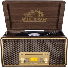 an old fashioned record player with the word victory on it's front and side