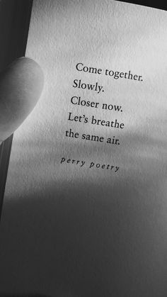 someone is holding an open book with the words come together slowly close now, let's breathe the same air