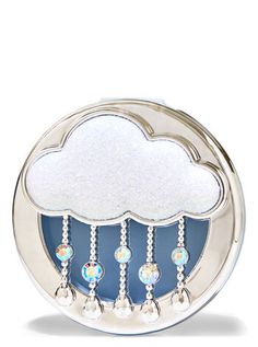 a cloud shaped object with beads hanging from it's sides on a white background