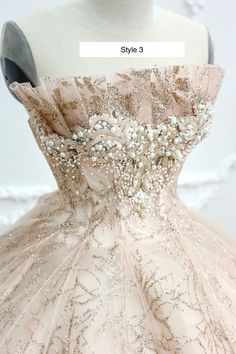 the back of a dress with beading and sequins on it is shown