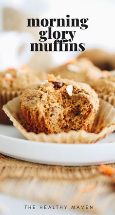 a muffin sitting on top of a white plate next to another muffin with the words, morning glory muffins