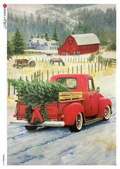 an old red truck carrying a christmas tree