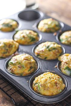 a muffin tin filled with some tasty looking food