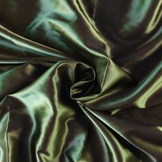 This is absolutely beautiful pure 100% silk satin fabric. Lovely quality with a smooth handle, in a lovely, sophisticated olive green. Lovely weight and drape; this fabric will make beautiful evening dresses, gowns, tops and so on. If you buy multiples of this fabric, it will be cut in a continuous length. Fabric: 100% Silk Weave: Satin Colour: Olive Green Width: 45" Green Bias Cut Satin Dress For Formal Occasions, Green Satin Bias-cut Evening Dress, Green Silk Satin Dress For Formal Occasions, Green Satin Bias Cut Evening Dress, Green Satin Dress For Evening With Bias Cut, Solid Color Silk Satin Dress, Green Silk Satin Party Dress, Green Silk Satin Dress For Wedding, Beautiful Evening Dresses