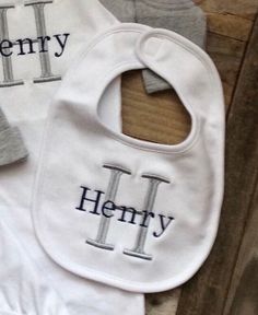 "Perfect for your little one or a great custom shower gift!  Listing is for (1) white bib w/ your chose of embroidered monogram or name.  DETAILS: 100% Cotton 11\" in length 8.5\" in width Velcro Closure At checkout please include the following information: 1.) Font 2.)Thread Color 3.) Name or Monogram **EXAMPLE** Font: School Book Thread Color: Grey and Navy Name or Monogram: Henry NOT PROVIDING ALL OF THE REQUIRED INFORMATION FOR PERSONALIZATION WILL DELAY YOUR ORDER. Care Instructions ♥  Mach Customizable White Bib For Babies, Customizable White Cotton Bib, Personalized Baby Bibs, Bandana Baby, Baby Monogram, Hudson Baby, Embroidered Monogram, Custom Shower, Monogram Styles