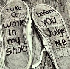 two pairs of shoes with words written on them that read, take q walk in my shoe