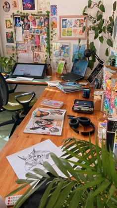 a wooden desk topped with lots of office supplies